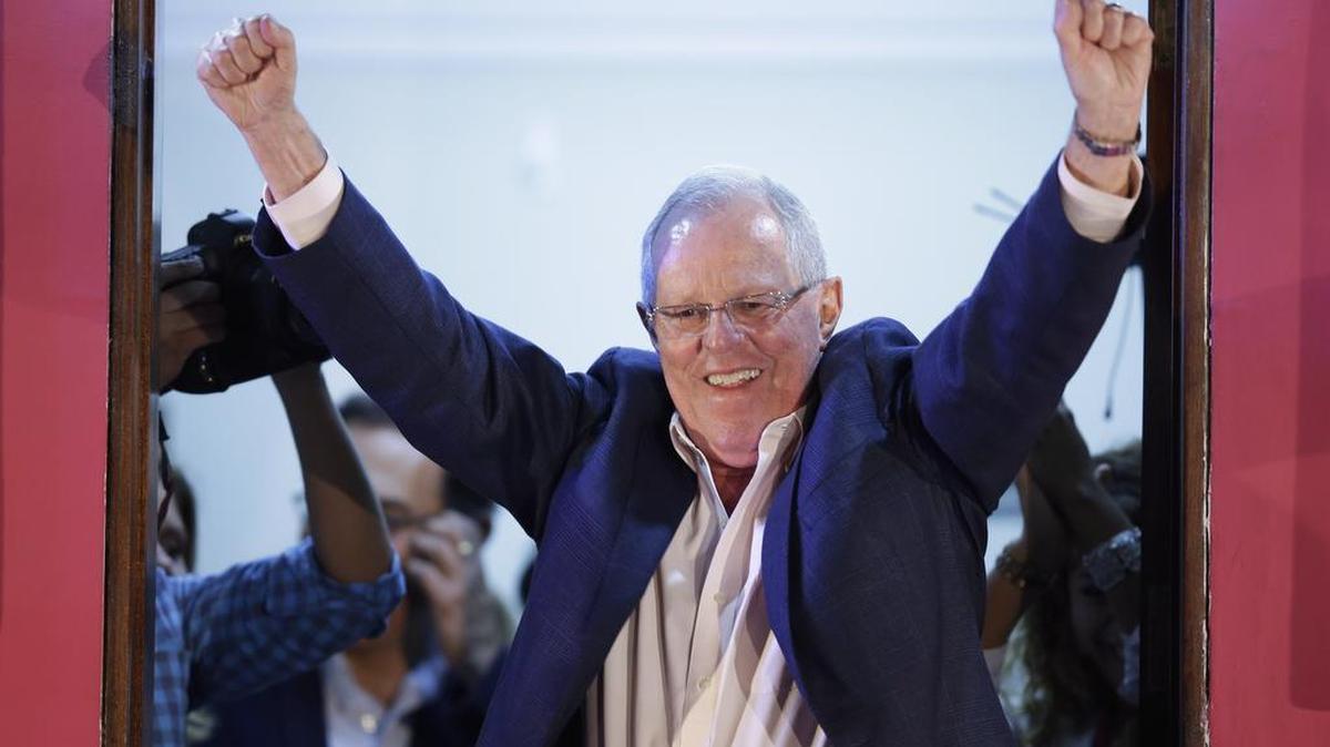 Presidential candidate Pedro Pablo Kuczynski celebrates from the balcony of his headquarter in Lima, Peru on June 5.