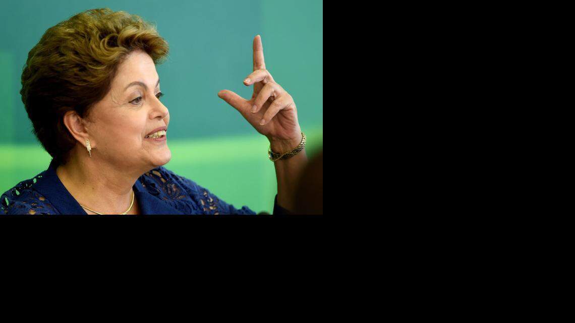 
Brazilian President Dilma Rousseff attends a breakfast with journalists at Planalto Palace in Brasilia, on December 22, 2014. Rousseff spoke about the achievements of her government in 2014 and the corruption scandal in the state oil company Petrobras, which could have an impact on her presidency into 2015. 
