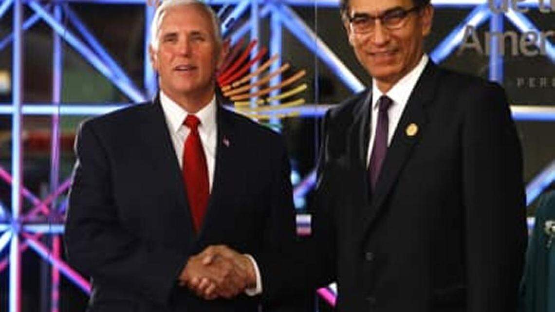 Vice President Mike Pence shakes hands with Peru’s President Martin Vizcarra at the outset of the Summit of the Americas in Lima last week.