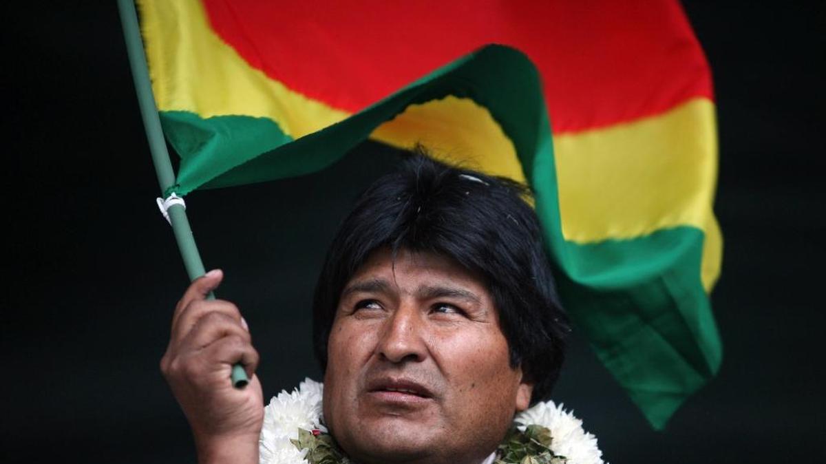 In this Jan. 22, 2009, file photo, Bolivia's President Evo Morales waves a Bolivian flag during a rally in support of the proposed new constitution in Cochabamba, Bolivia. Morales inaugurated a $7 million museum on Feb. 2, 2017, in his native village of Orinoca, coined the Museum of the Democratic and Cultural Revolution. Bolivia’s political opposition has dubbed it the "Evo Museum."
