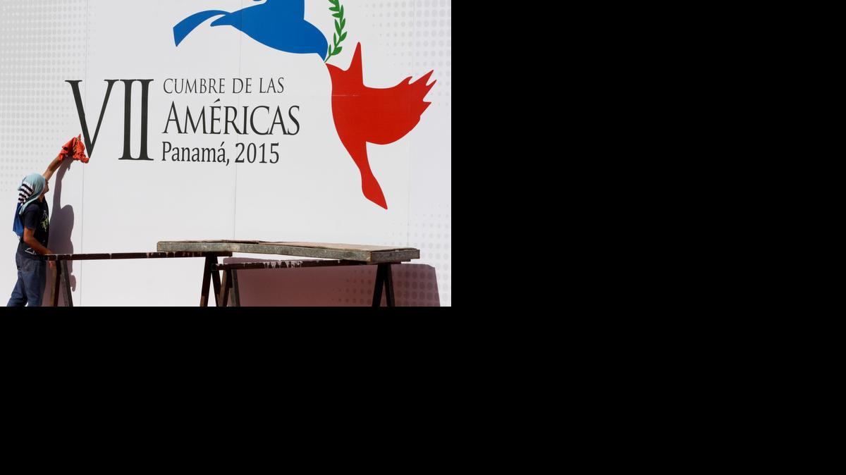 
A worker gives the finishing touches as he cleans a wall announcing the upcoming Summit of the Americas outside of the Atlapa Convention Center in Panama City. The venue will host the seventh Summit of the Americas this April 10-11, attended by Western Hemisphere leaders. 
