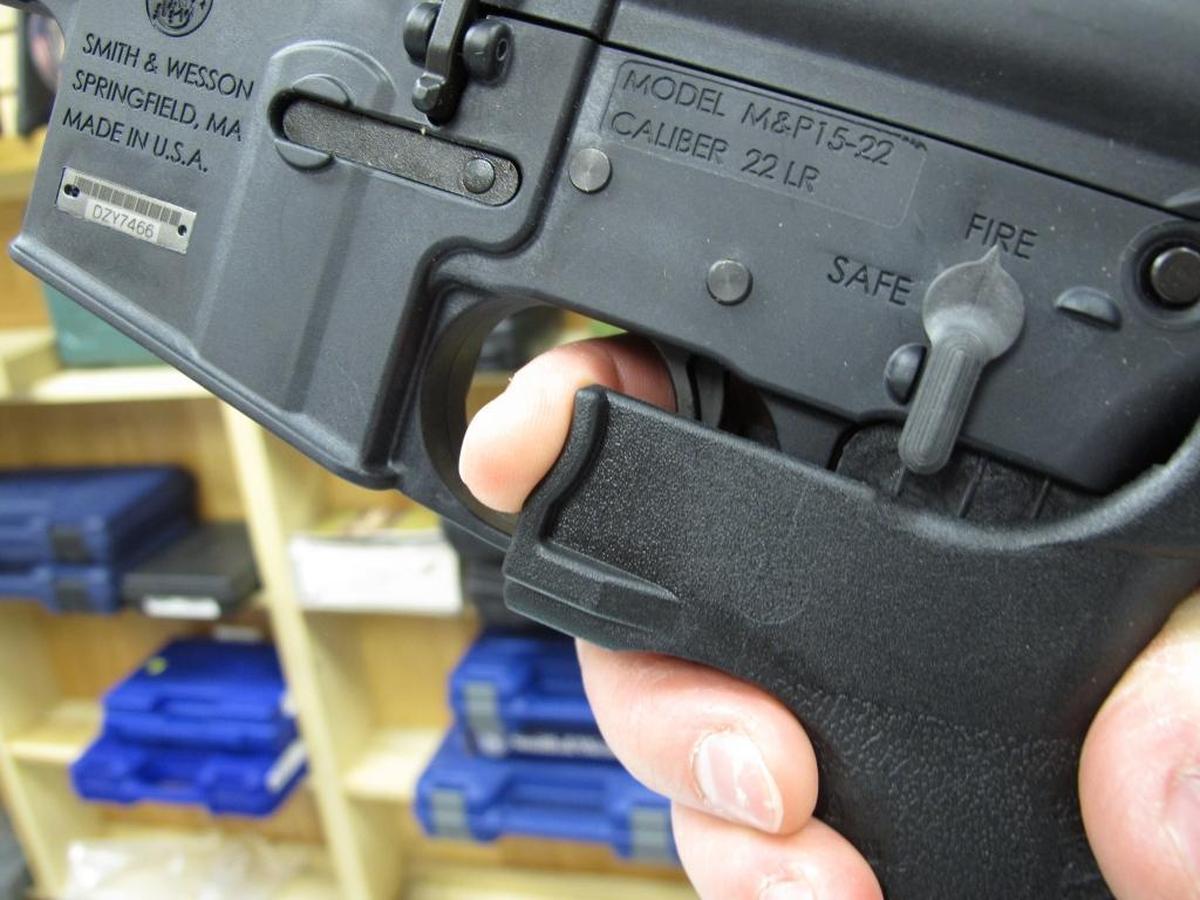 In this Feb. 1, 2013, file photo, an employee of North Raleigh Guns demonstrates how a ‘bump’ stock works at the Raleigh, N.C., shop. The gunman who unleashed hundreds of rounds of gunfire on a crowd of concertgoers in Las Vegas on Monday attached bump stocks to two of his weapons, in effect converting semiautomatic firearms into fully automatic ones.