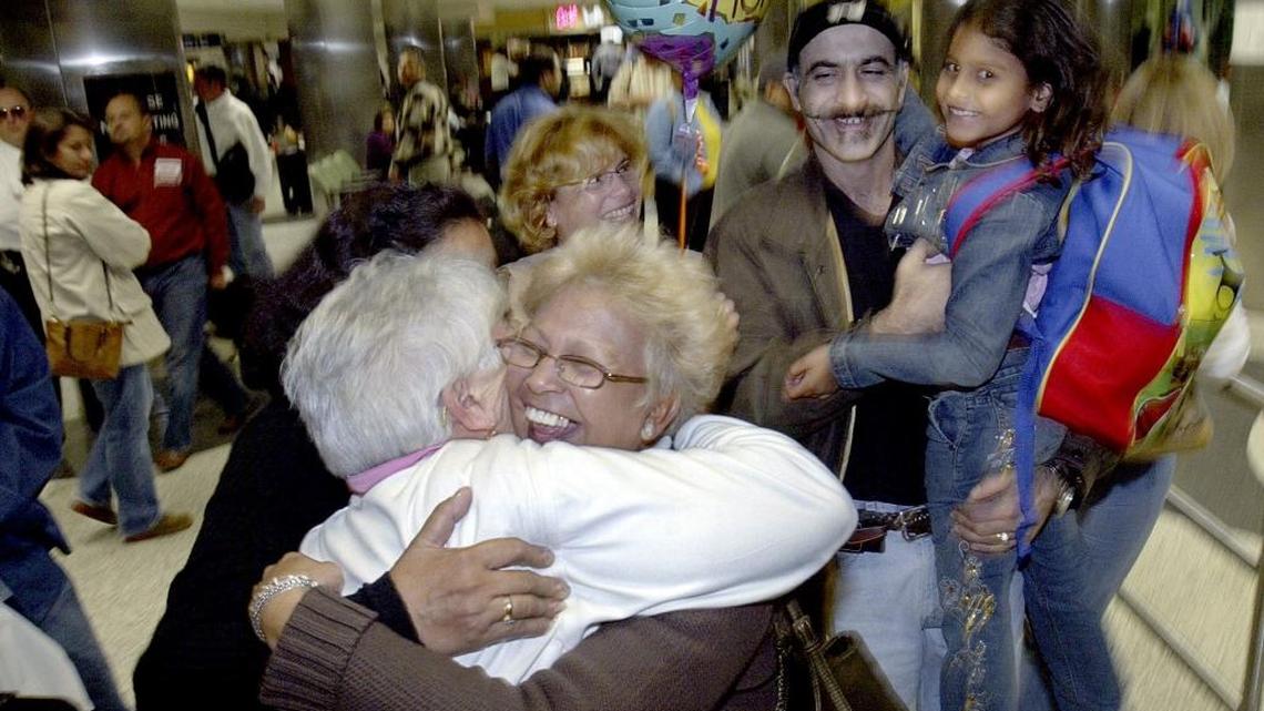 Celia Llamo hugs her sister Amparo Llamo as she arrives at Miami International Airport from Cuba in 2006.