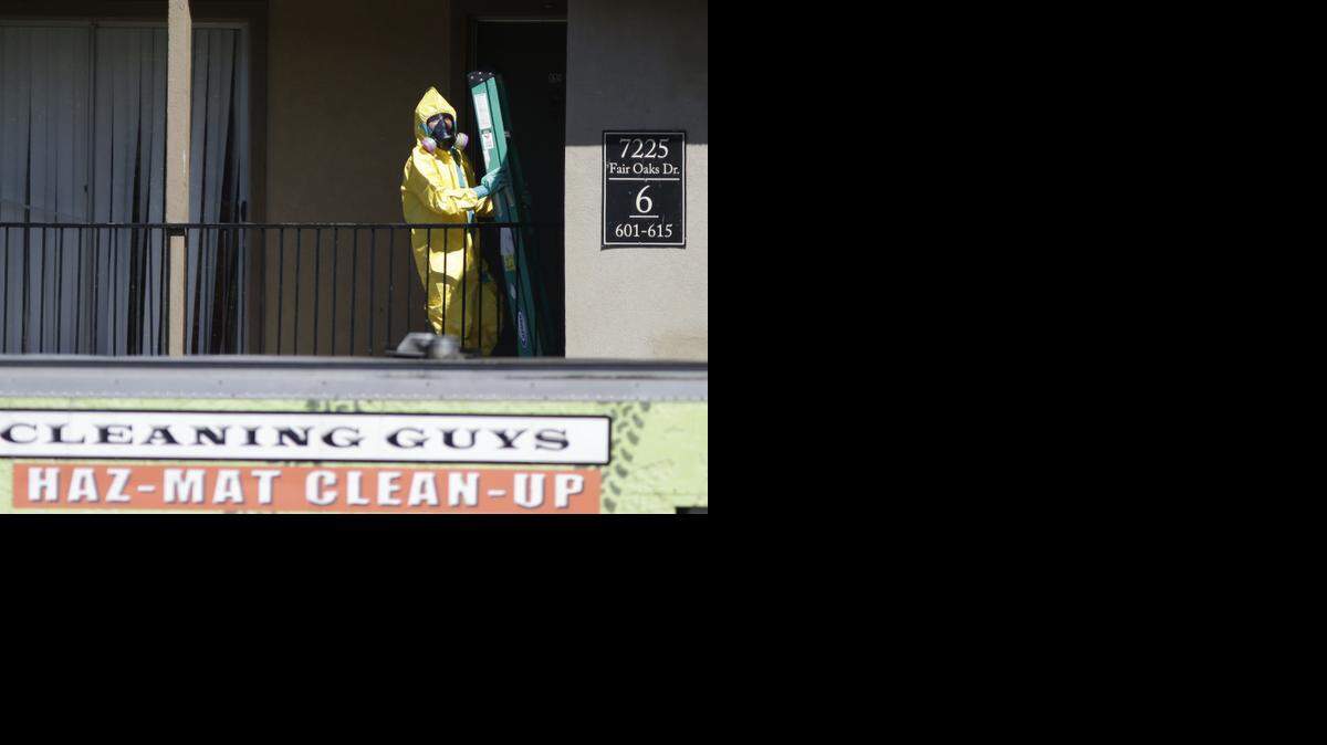 
A hazardous material cleaner arrives at the apartment complex in Dallas, Friday, Oct. 3, 2014, where Thomas Eric Duncan, the Ebola patient who traveled from Liberia to Dallas stayed last week. The crew is expected to remove items including towels and bed sheets used by Duncan, who is being treated at an isolation unit at a Dallas hospital. The family living there has been confined under armed guard while being monitored by health officials. 
