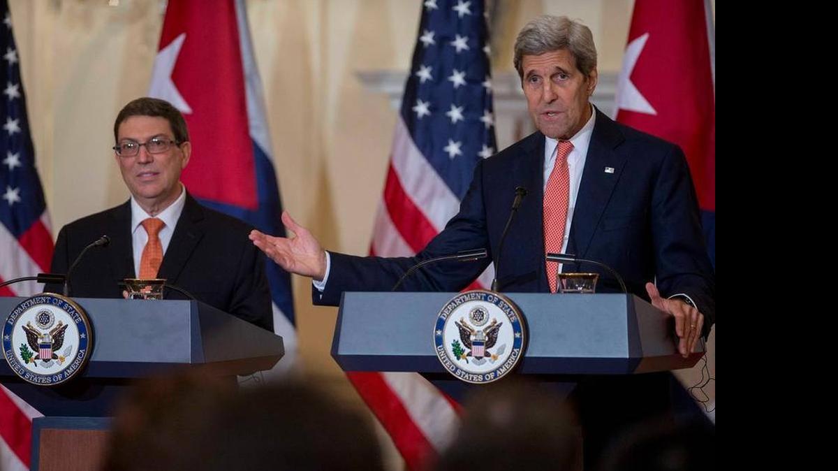 
John Kerry, U.S. secretary of state, right, speaks during a news conference with Bruno Rodriguez, Cuba's foreign minister, at the State Department in Washington, D.C., on Monday as Cuba and the U.S. reopened embassies.
