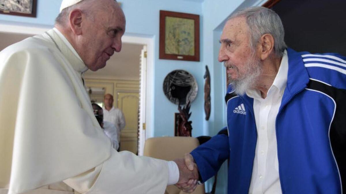 
Pope Francis and Cuba's Fidel Castro shakes hands, in Havana on Sept. 20. The Vatican described the 40-minute meeting at Castro's residence as informal and familial, with an exchange of books. 
