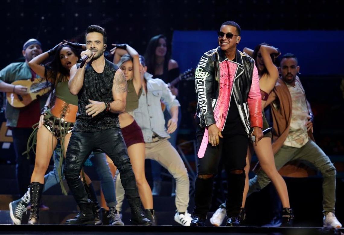 Singers Luis Fonsi, left and Daddy Yankee perform during the Latin Billboard Awards in Coral Gables, April 27, 2017.