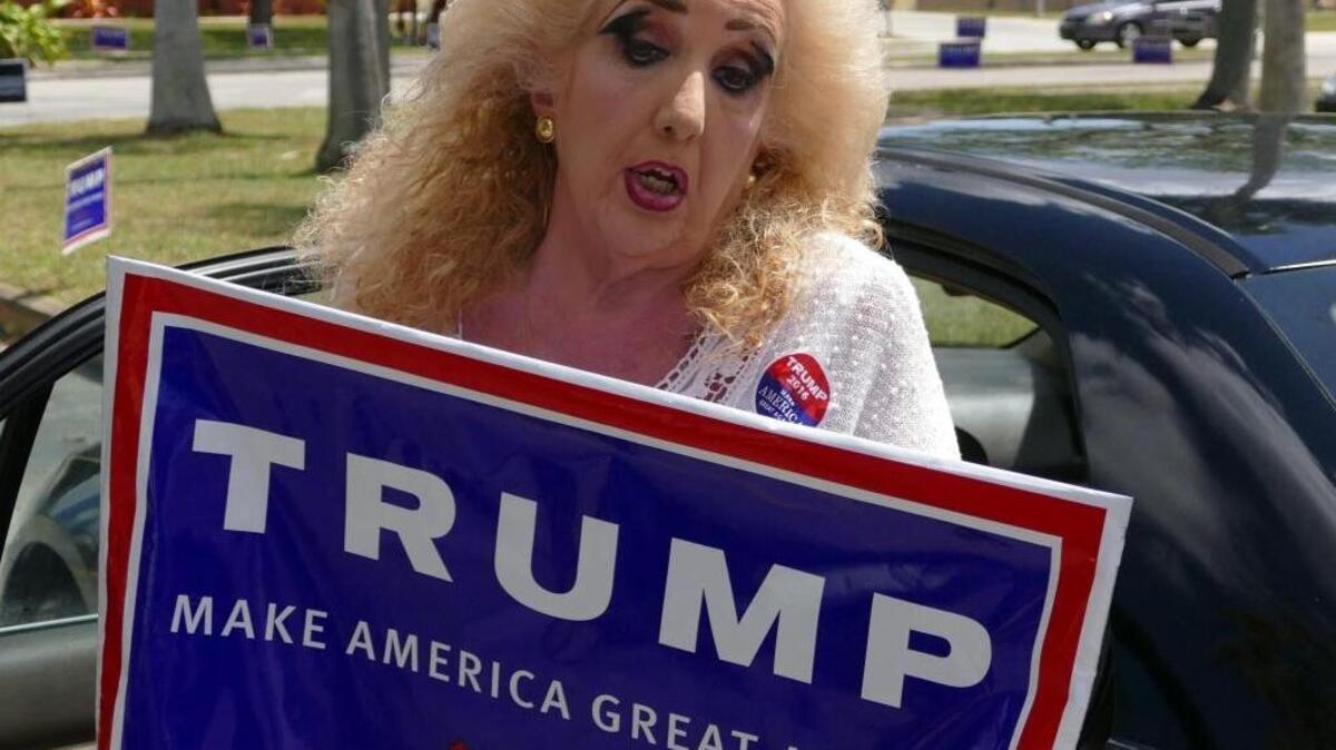 Clara Roteta, 60, talks to the media outside the West Dade Regional Library during Florida's presidential primary on March 15.