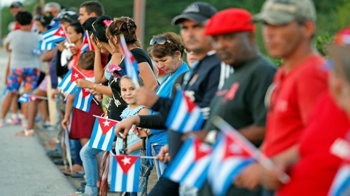 Cubans wait for the passage of Fidel Castro's ashes outside of Ranchuelo, Cuba on Wednesday, November 30, 2016.