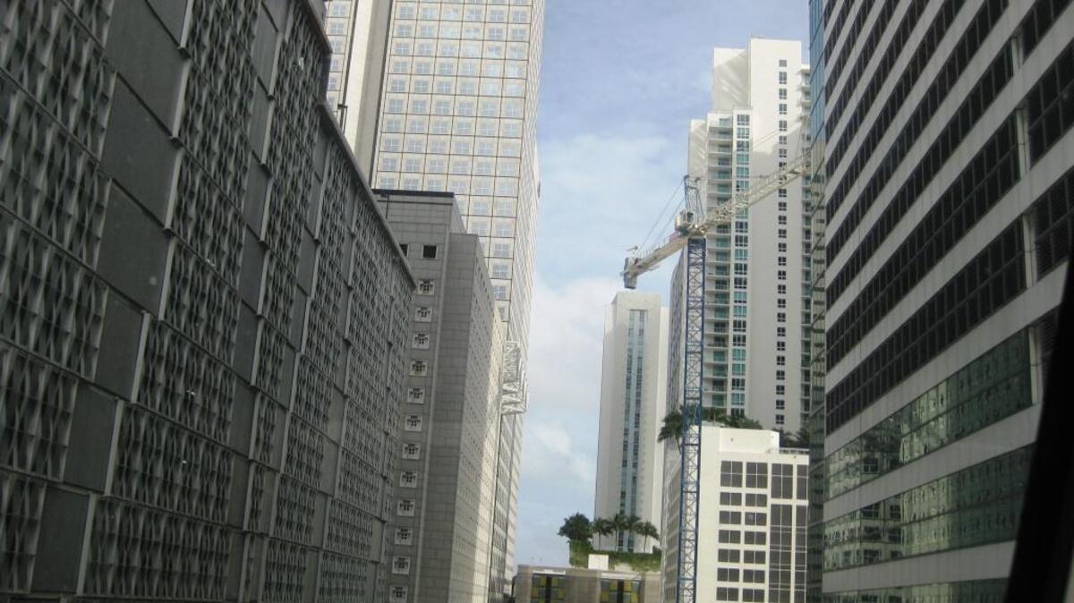 Metromover snakes around old and new Brickell buildings.