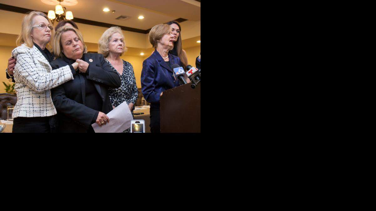 
U.S. Rep. Ileana Ros-Lehtinen, R-Fla., second from left, comforts Miriam de la Pena during a news conference, Wednesday, Dec. 17, 2014 in Coral Gables.
