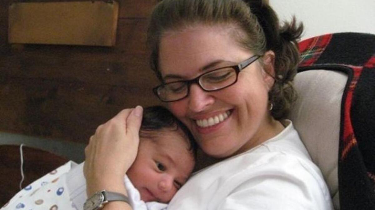 Columnist Fabiola Santiago with newborn grandson, Devereaux, in 2008.