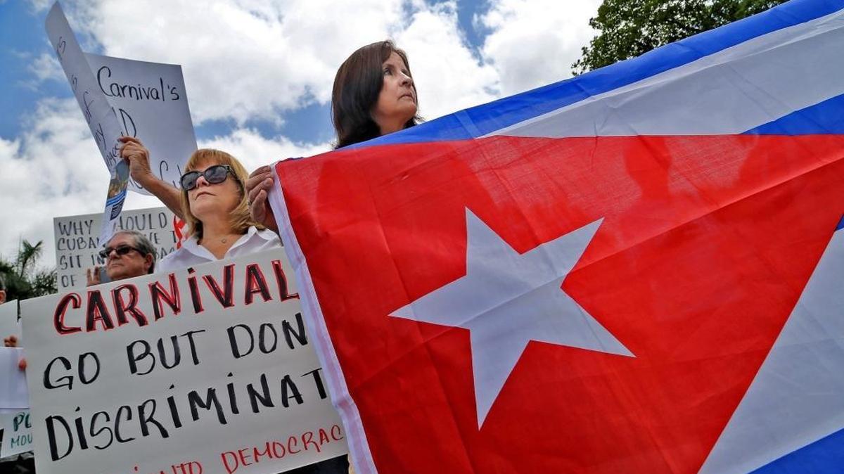 Norys Aguila, center, who came to the U.S. during Pedro Pan exodus in 1961, is protesting the Cuban policy of denying Cuban-born Americans from entering the country by sea.