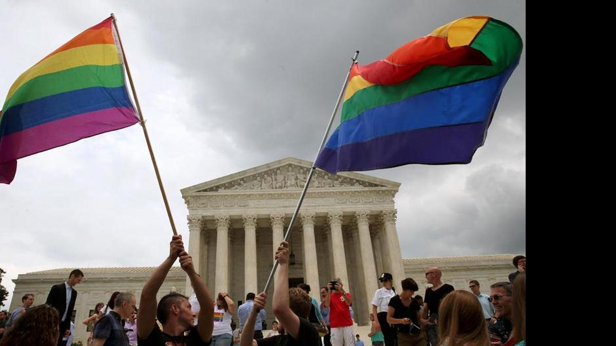 
People celebrate in front of the U.S. Supreme Court on Friday after the ruling in favor of same-sex marriage.
