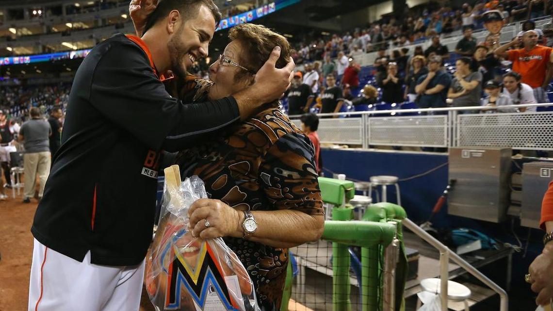 Miami Marlins pitcher Jose Fernandez hugs his grandmother after defeating the the Atlanta Braves on Sept. 25, 2015, at Marlins Park.
