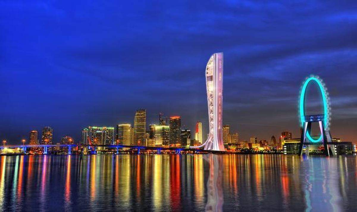 A conceptual rendering of the Miami skyline lit up by the previously proposed “Eye on the Bay” Ferris wheel and SkyRise Miami looking west from Watson Island.