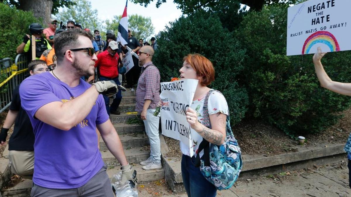 This image shows a white supremacist, left, confronted by a counter demonstrator at Emancipation Park in Charlottesville, Virginia, in August 2017.