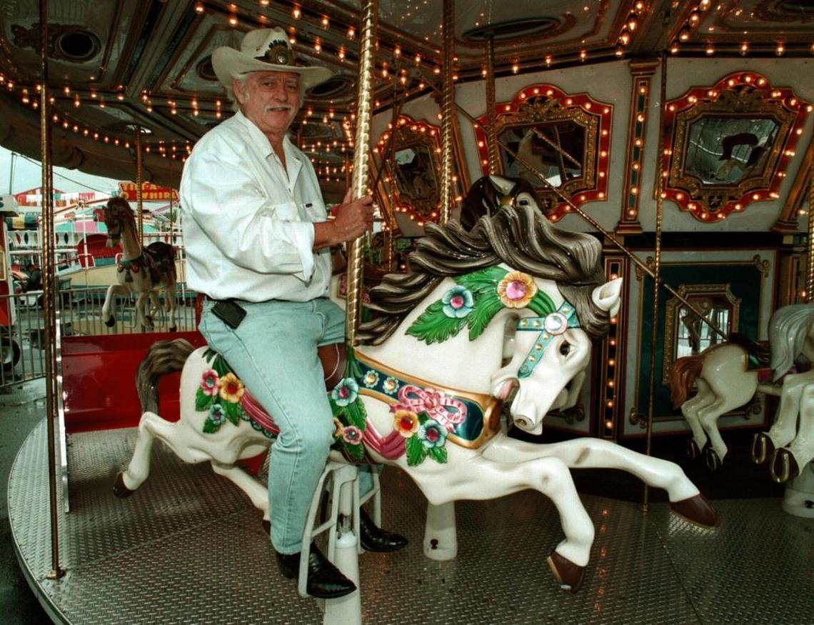 Preston Henn sits on his Swap Shop carousel on April 10, 1997.