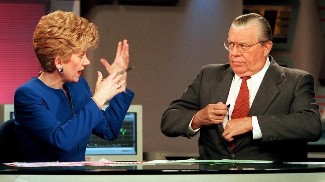 On-camera colleagues for years, Linda O’Bryon (left) former executive vice president and executive editor, and Paul Kangas (right), co-anchor and financial commentator, discuss a news package to air on their WPBT-2 show, “Nightly Business Report,” on Feb. 10, 1998.