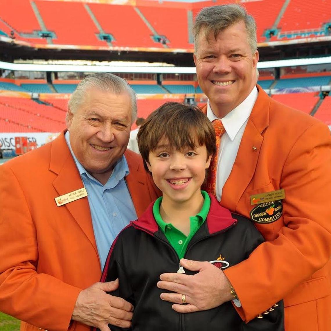 Arthur Hertz (left) with grandson Joshua Myles and son Andrew Hertz at an Orange Bowl game.
