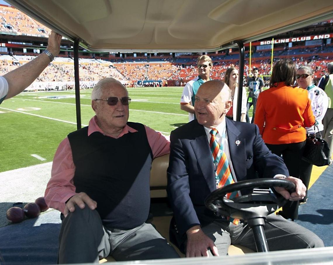 Don Shula and Wayne Huizenga sit in a golf cart before the game between the Miami Dolphins and the New York Jets at Sun Life Stadium in Miami Gardens on Jan. 1, 2012.