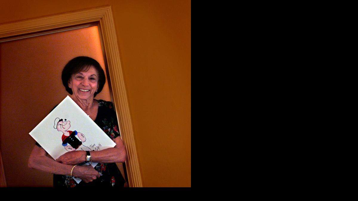 
ARTIST: Jean Karaty worked as an opaquer for Miami's Fleischer Studios from 1938 to 1943, the studio that produced Popeye, Betty Boop and Superman cartoons. She is seen at her home in the Roads in this July 2003 photo.
