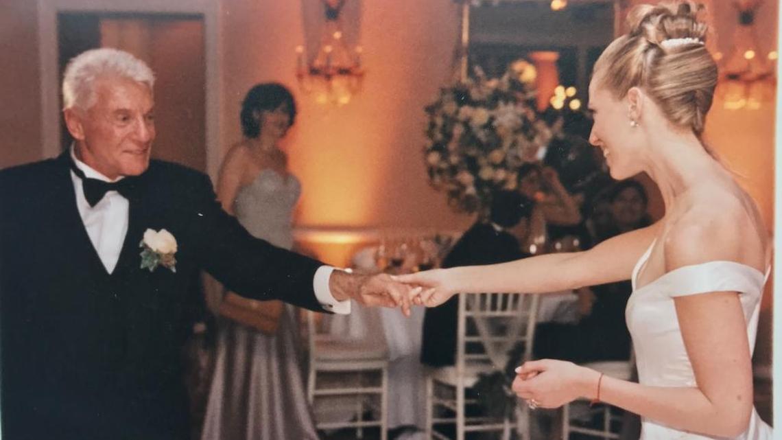 Leon Simkins (left) dances with his daughter, Michelle Simkins Rubell. Supporting charities became a family affair.