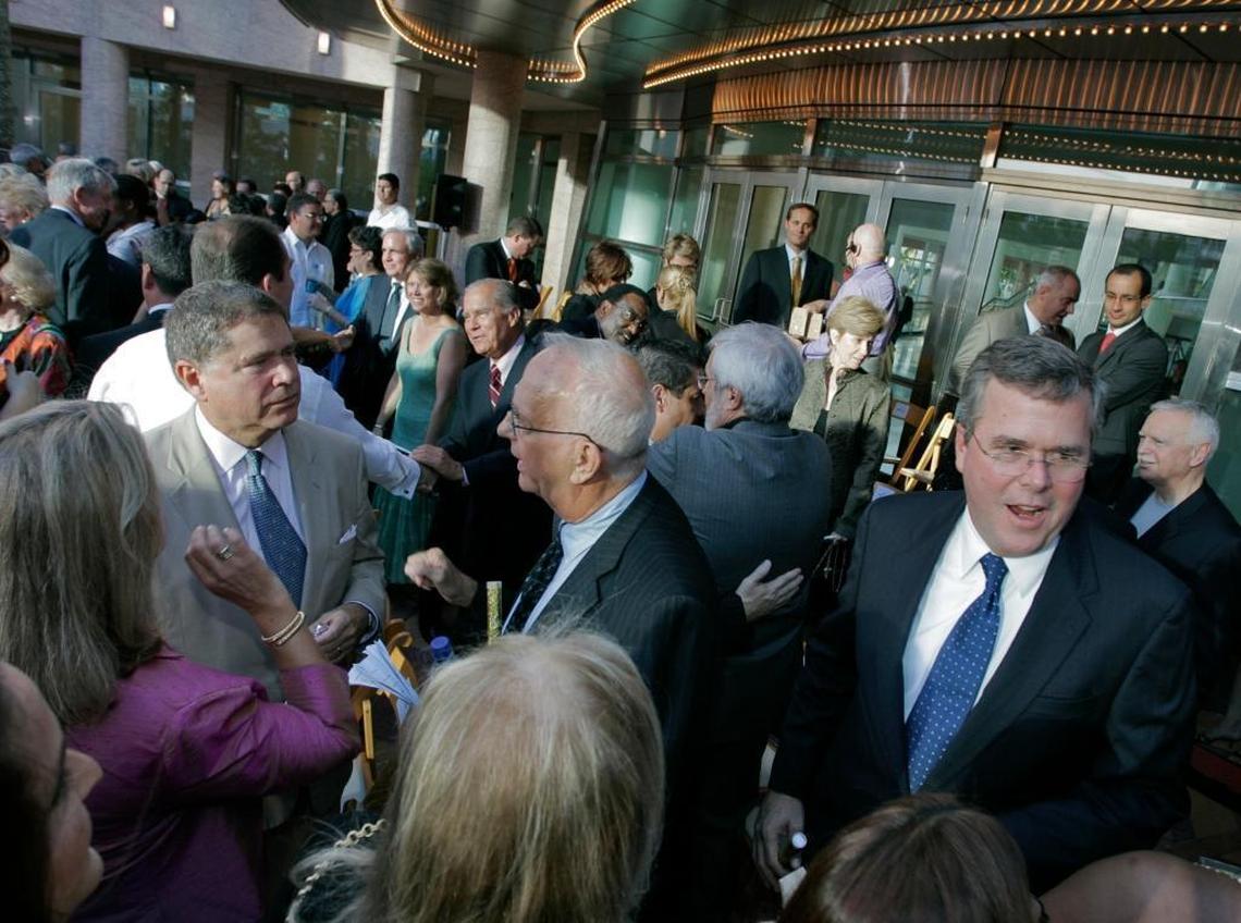 Alberto Ibargüen, Parker Thomson and then Gov. Jeb Bush socialize before the opening ceremonies of the Carnival Center for the Performing Arts in the Plaza for the Arts (later Arsht Center) in 2006 in downtown Miami.