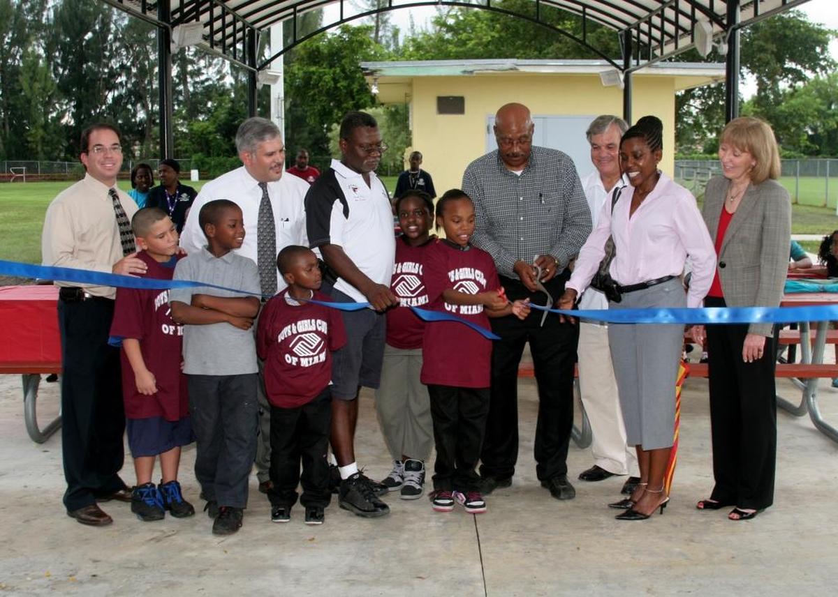 In this Sept. 2009 file photo, Boys & Girls Club of Miami-Dade unit director Kenny Wilcox helps cuts the ribbon at an event at the Northwest Club.