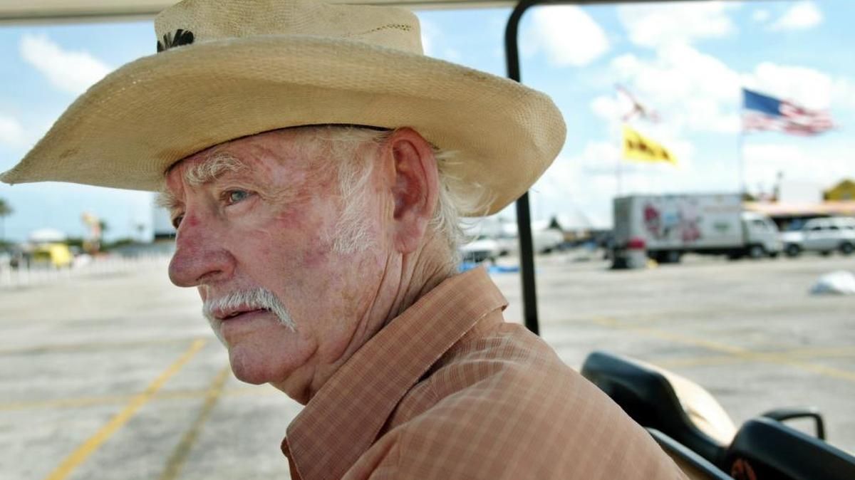 Swap Shop owner Preston Henn surveys the grounds of his business from his golf cart in this 2005 file photo. Henn maintained the practice for six decades.