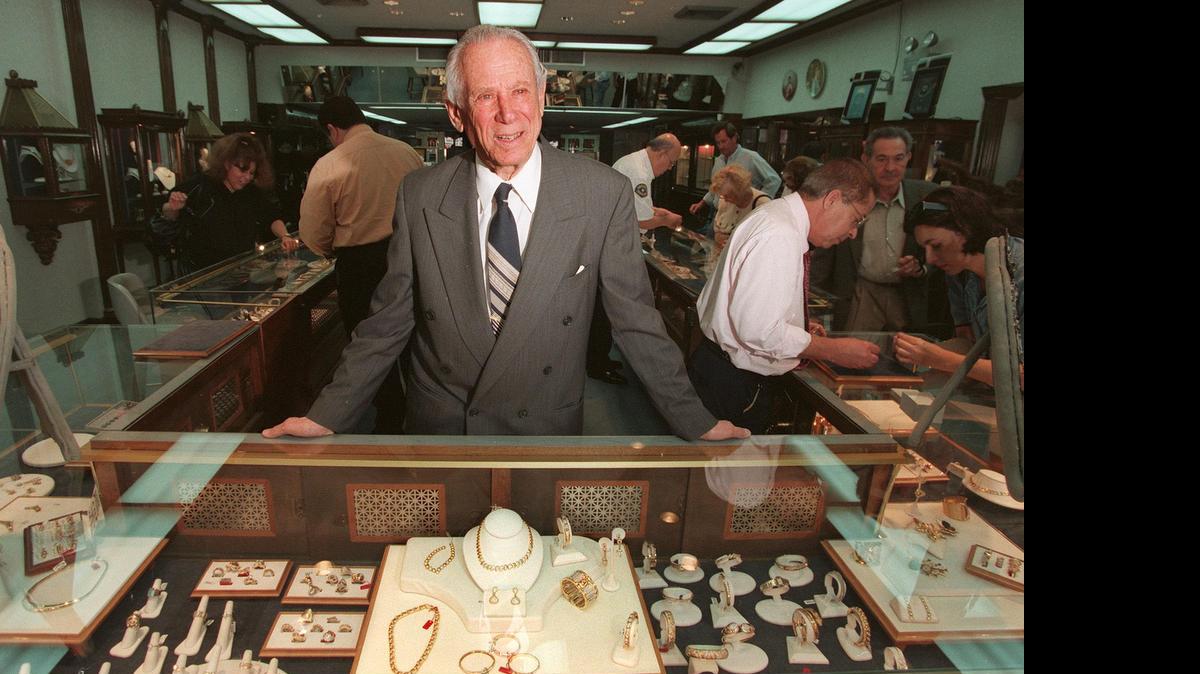 
SURROUNDED BY BEAUTY: David Balogh, in December 1998 at the flagship Balogh Jewelers store he opened with late wife Sallie, on Miami Beach’s 41st Street after World War II. Balogh Jewelers, which included branches in Coral Gables, Hallandale Beach and New York, catered to a knowledgeable clientele that included celebrities and royalty for more than 50 years.
