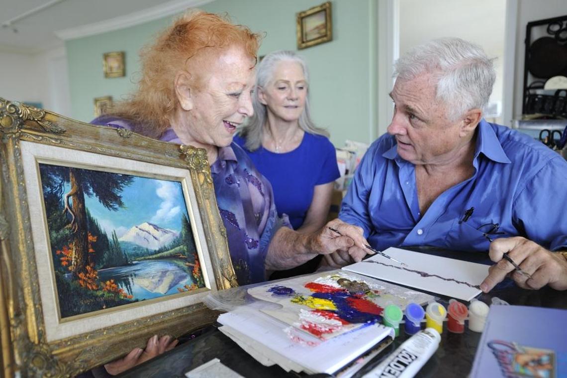 Artist Conni Gordon gives a painting lesson to Barbara Pergament and Richard Israel in her home studio on Miami’s Upper East Side in 2011.