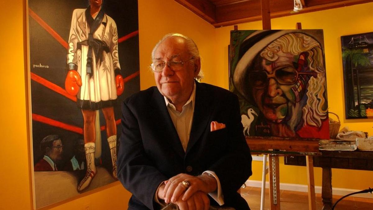 Ferdie Pacheco, Muhammad Ali's fight doctor, sat before a portrait he did of Ali in this Feb. 26, 2004, file photo.