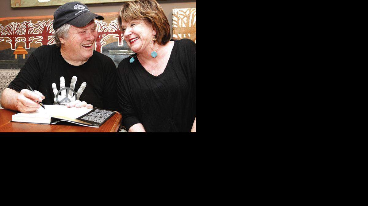 
MUSICAL MEMORIES: In this March 25, 2012 file photo, saxophonist Bobby Keys signs a copy of his autobiography, ‘Every Night’s a Saturday Night: The Rock 'n' Roll Life of Legendary Sax Man Bobby Keys, for Jo Claire Swayze, right, in Greenwood, Miss. Keys, who performed with the Rolling Stones and on recordings with John Lennon, George Harrison, Carly Simon and Eric Clapton, died at his home in Franklin, Tenn. He was 70. 
