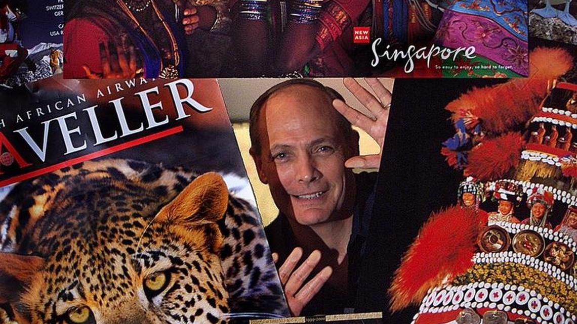 Phil Bakes in 2000, when he was chairman and CEO of Far & Wide Travel Corporation at his office in Miami surrounded by travel posters and brochures. Bakes was former president of Eastern and Continental airlines.