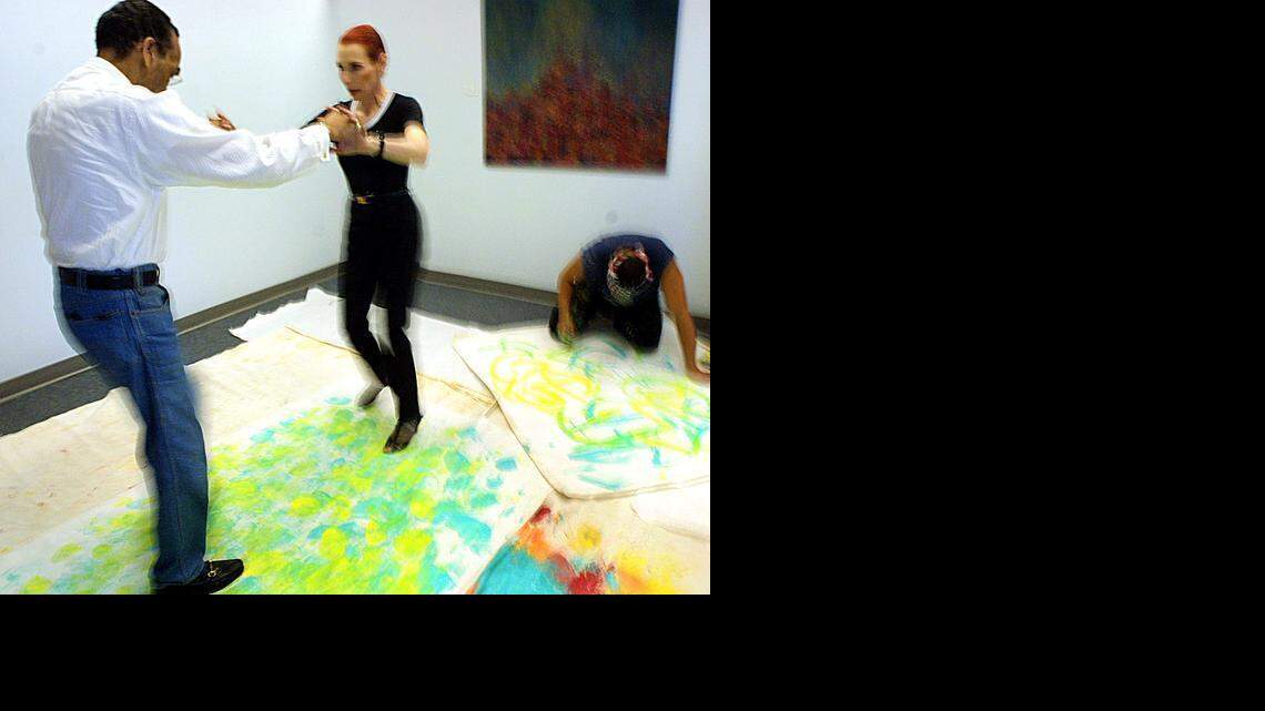 
FEET ON EXHIBITION: The original ‘Mambo King,’ Pedro Aguilar, also known as Cuban Pete, danced with partner Barbara Craddock as artist Erich Padilla painted their moves on canvas at the Byron-Carlyle Arts Center in Miami Beach on July 17, 2002. Padilla, working for the International Latin Music Hall of Fame, used a wooden clave dipped in paint to capture the dance pros’ footsteps for an exhibit.
