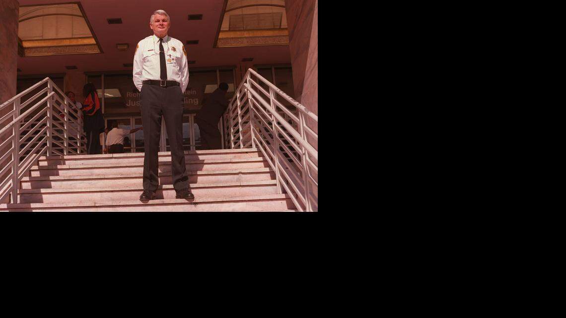 
BAILIFF: Mark Reno, brother of U. S. Attorney General Janet Reno, is seen here in January 2000 when he was a bailiff at the Miami-Dade Justice Building. Reno would keep a roll of paper towels with him to comfort people who burst into tears upon sentencing.
