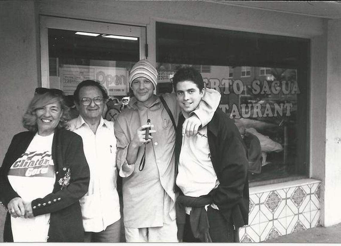 Fanita and Dr. Mario Presman, left, and their grandson, Brett Ratner, right, flank actor Mickey Rourke on Miami Beach in the 1990s.
