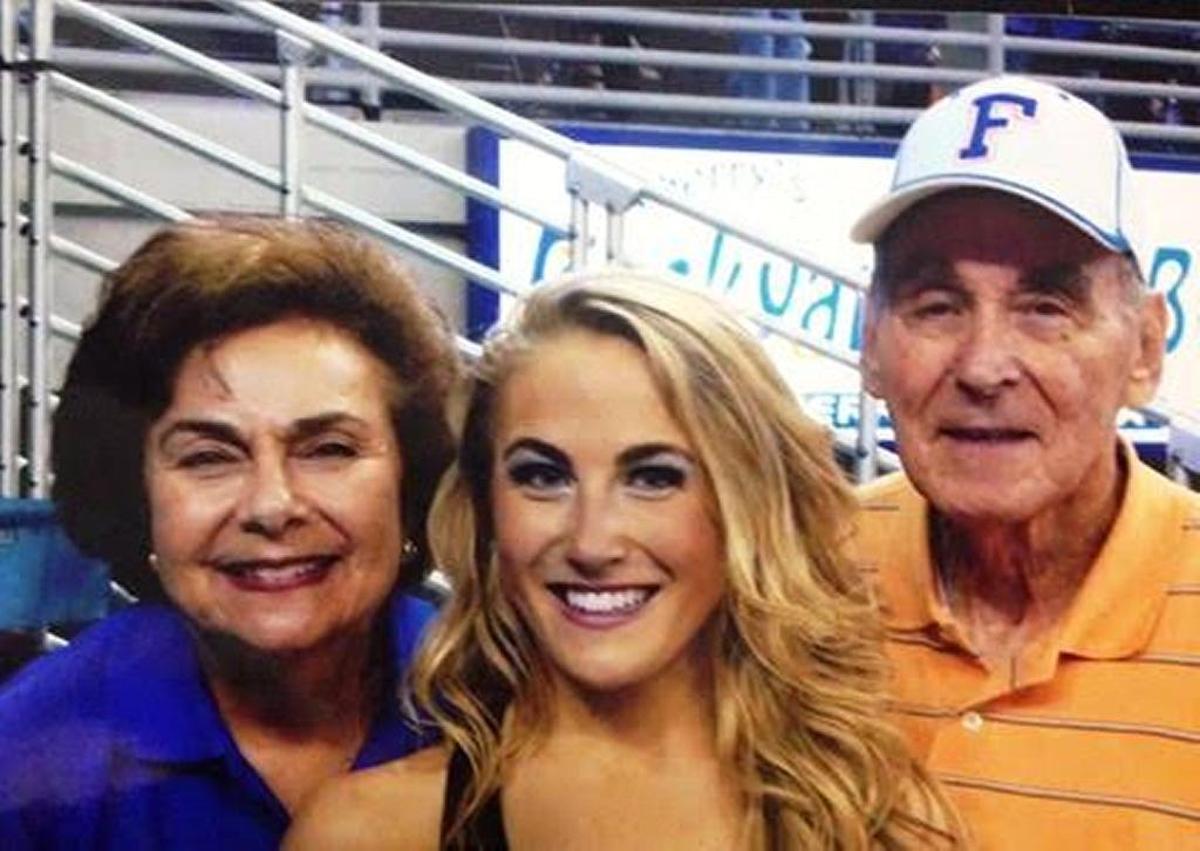 Wilma and her husband Edward Klein flank granddaughter Lauren Zwieg at a University of Florida basketball game, circa 2010.