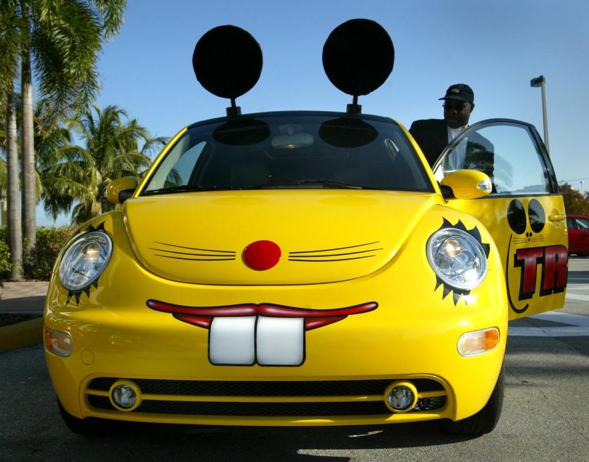 The then-new Volkswagen Beetle limo, from Truly Nolen, complete with the traditional mouse ears, with driver Darryl Graves, is pictured in Miramar in this Dec. 22, 2004 file photo.