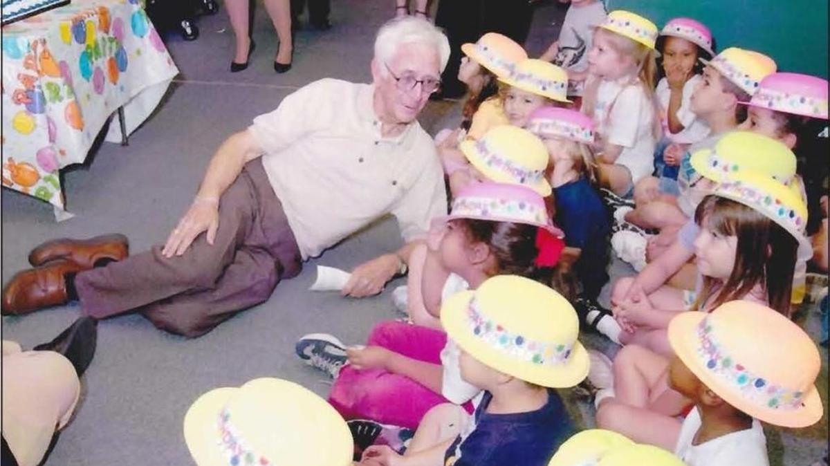 George Van Wyck with the kids from ABIG Child's Place at American Bankers Insurance Group. The day-care center was dedicated to Van Wyck for his pioneering role in securing day care availability at the company.