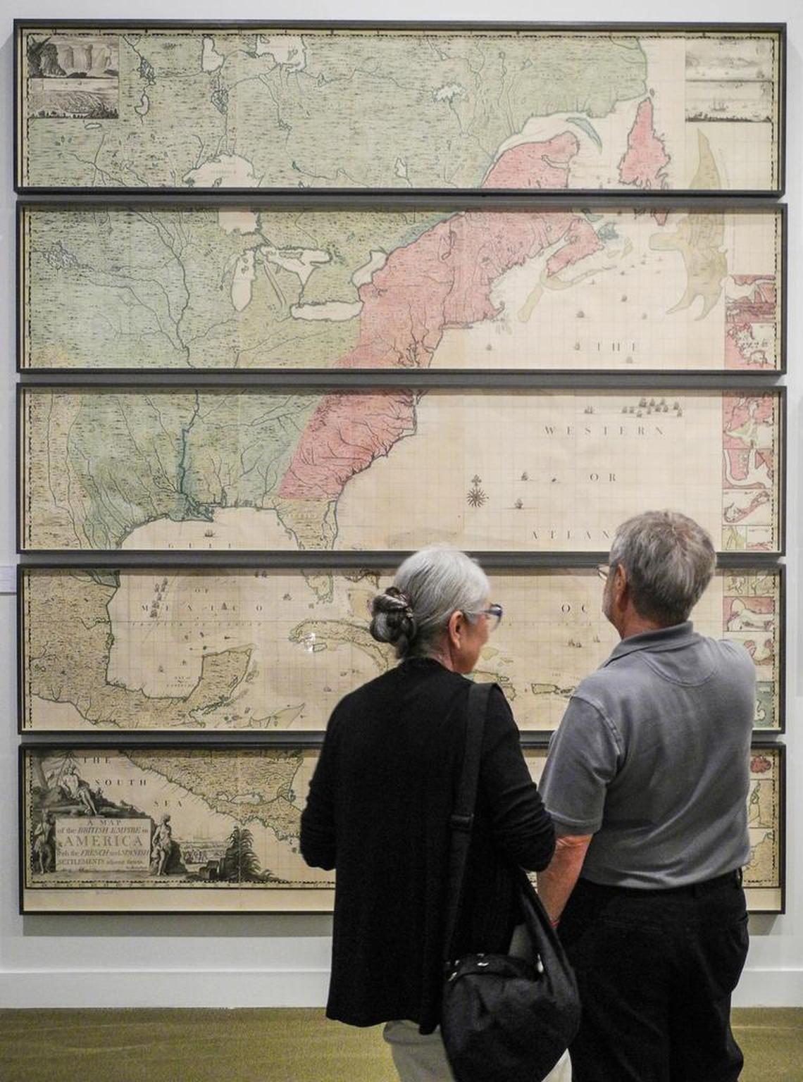 Harold and Karen Rifas looked at a map of the original 13 colonies from 1733 by Henry Popple. The map was valued at $250,000 and was on display at the 21st Annual Miami International Map Fair at HistoryMiami in 2014.