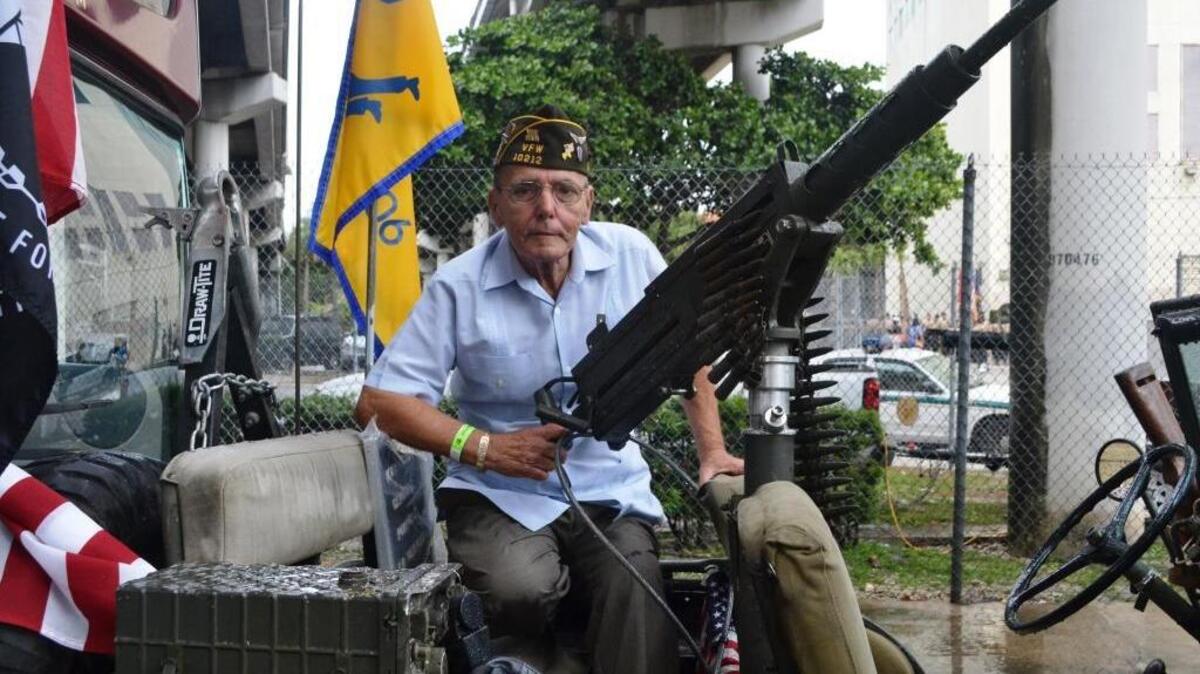 Jacinto ‘Ace’ Acebal is comfortable behind a Vietnam-era .50 caliber machine gun mounted on a vintage Jeep under I-95, west of the Flagler Courthouse in Miami in November 2013. He earned 18 medals for his service during Vietnam.