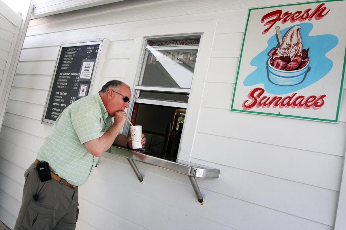 MILKSHAKES: Customers, like Bruce MacFarlane, come from miles around for one of Knaus Berry Farm’s milkshakes, which come in standard flavors like vanilla, chocolate and strawberry, and exotic like mango and other seasonal favorites.