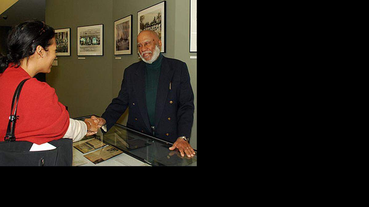 
LIVING HISTORY: Bob Simms, a University of Miami Trustee and former director of the Metro-Dade Community Relations Board and a civic activist, greets a visitor to an exhibition of his memorabilia at the University of Miami on Feb. 28, 2008.
