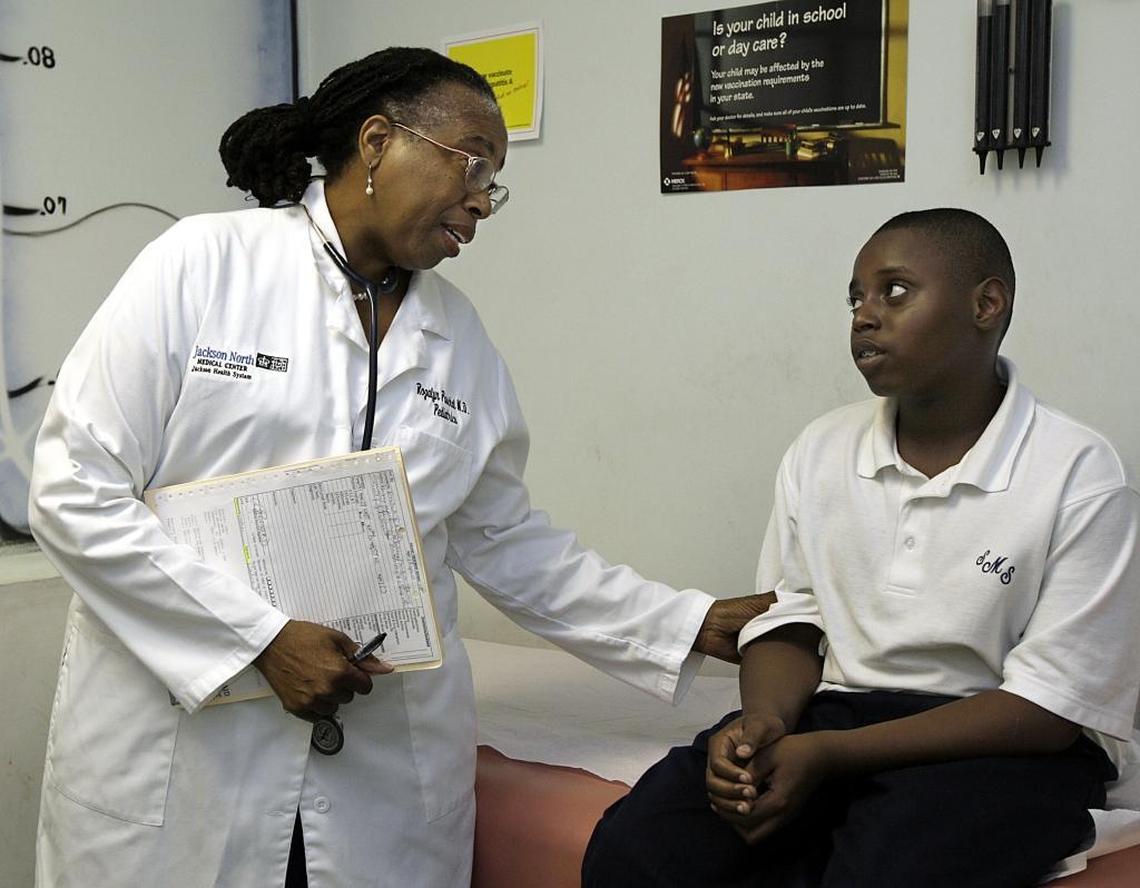 Dr. Rozalyn Paschal talked with patient Paris Webb, then-12, after an examination in this October 2007 file photo.