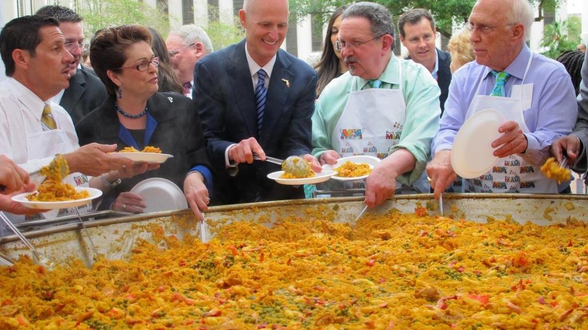 Bob Levy, second from right, dishes out paella during Miami-Dade Days, April 3, 2013, in the courtyard at the Capitol in Tallahassee. Levy, who died Tuesday at 67, was a pioneer of the annual event to promote Miami-Dade County in the Capitol.