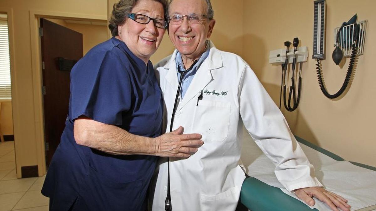 Doctor Alfredo Lopez-Gomez, then-82, with his wife Mary Lopez, then-72, at MAS Medical Group offices on Coral Way in May 2012. Dr. Lopez-Gomez was featured in a story on people in their 70s and 80s who are still working in demanding fields. In his 80s, Dr. Lopez-Gomez still practiced five days a week as an internist.