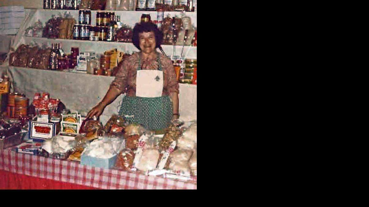 
CHURCH AND FESTIVAL FOUNDER: Mary Thomas ran her Lebanese food display, seen here at the 1979 Our Lady of Lebanon Church's annual festival, which she helped create in 1978 to raise funds for the church’s mortgage. Thomas and her husband Joe founded and developed the Our Lady of Lebanon Church in 1973 on Coral Way in Miami.
