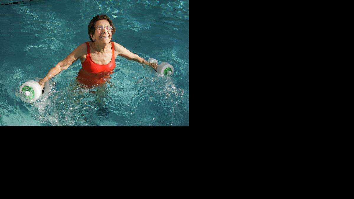 
FITNESS BUFF: In a February 2008 photo Edna Shalala, then 96, ran through a series of water exercises in her pool in Coral Gables. Fitness was a lifelong passion for Shalala. She was an Ohio tennis champ and won an 80-and-over national championship.
